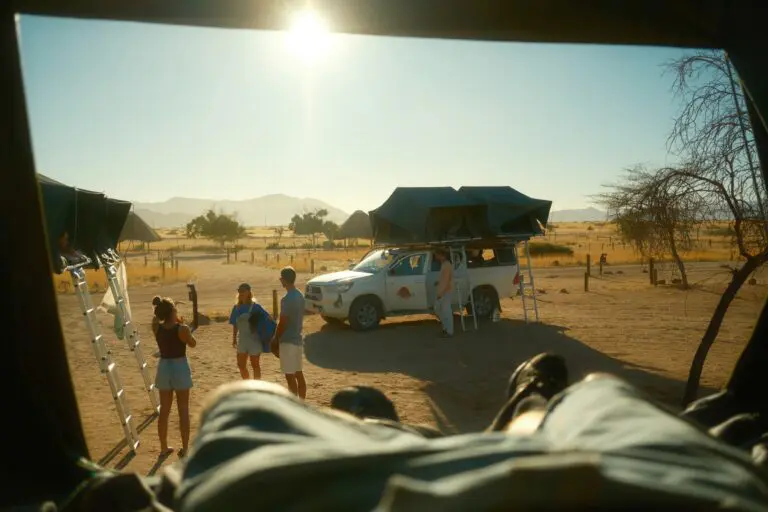 people camping with rooftop tents in the Namibian desert