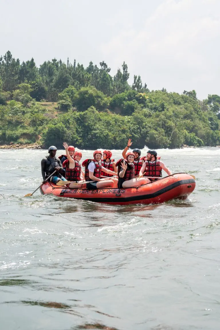 group of people white water rafting on a river in Uganda