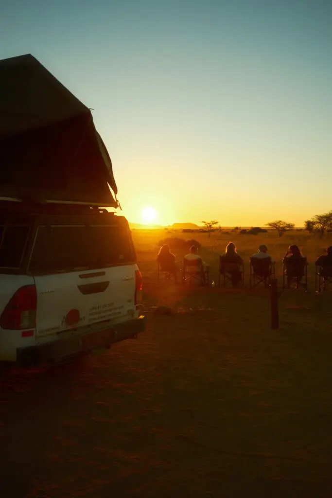 group watching sunset from camp in Namibia