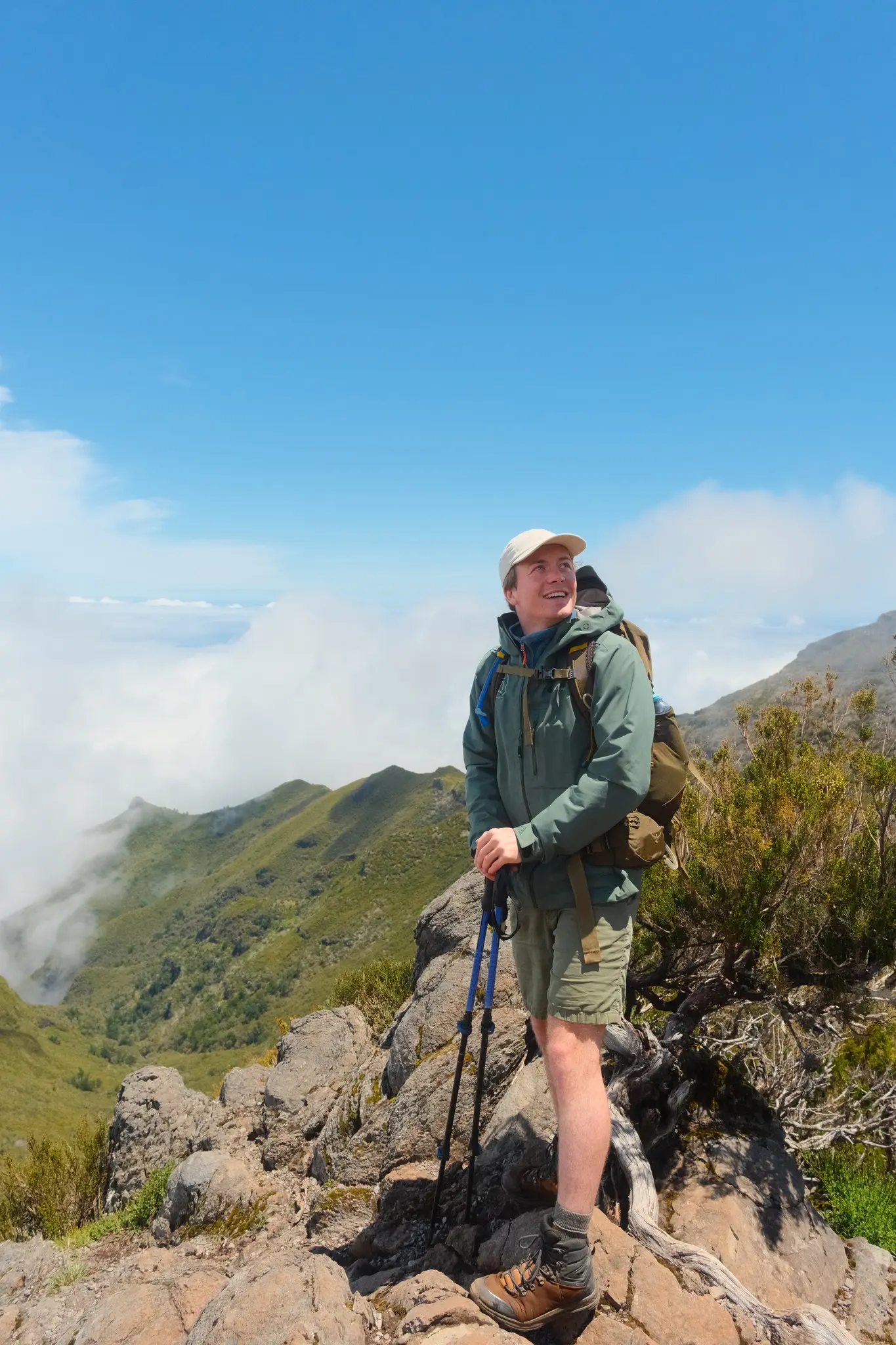 hiker on a mountain ridge looking at the view