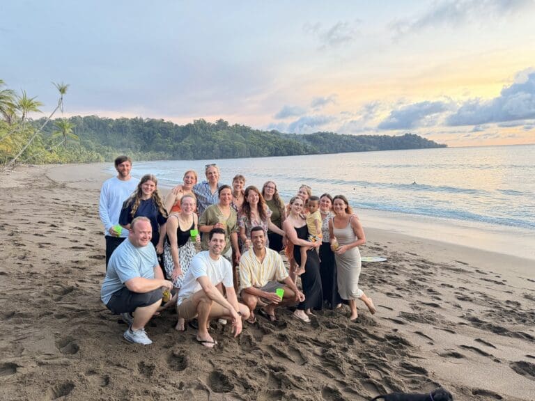 group of friends on a beach at sunset in Costa Rica